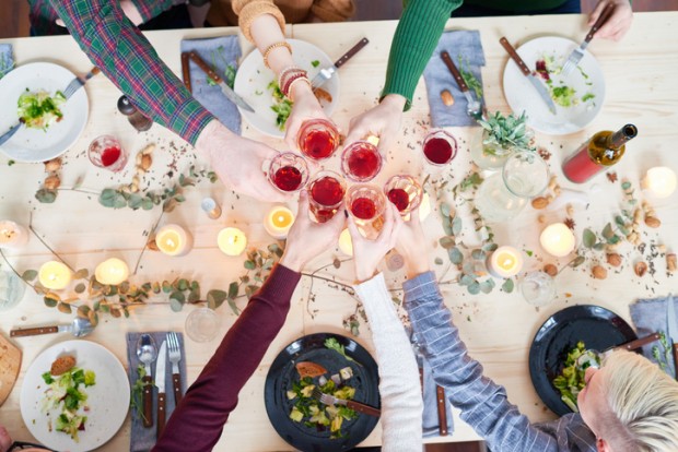 Directly above view of celebratory toast of friends