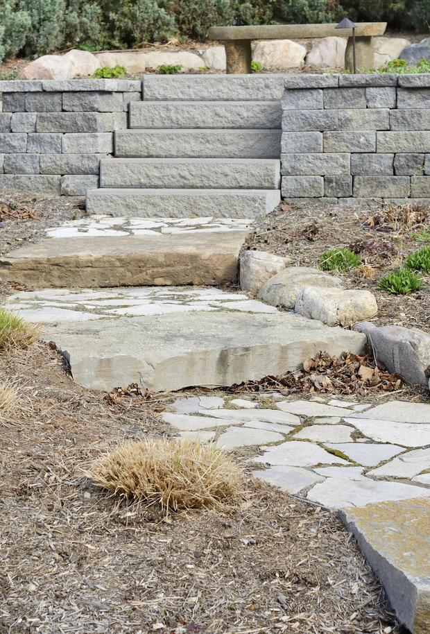 A professional landscaping job with stone path and stone steps.